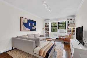This pristine two bedroom, two bathroom home offers a smart, light filled layout with northern and southern exposures and charming treetop views.