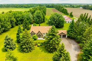 Nestled on approximately 24 acres of mature, treed landscape, this stunning custom built 3 bedroom home offers the perfect balance of comfort, space, and opportunity.