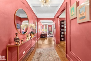 One enters the apartment through a gracious entry gallery leading to a spacious south facing living room, and a large west facing formal dining room.