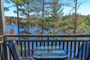 Welcome to 5521 Grandview Signature, a stunning ground floor waterfront condo offering the ultimate Fairy Lake lifestyle in the heart of Muskoka.
