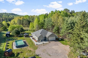 Welcome to 12 Eastern Avenue, a beautifully designed 4 bedroom, 2 bathroom home nestled on just over an acre in a peaceful and private setting near the village of Griffith.