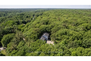 Perched in a private, forested setting just a few minutes from the highly desired Macaulay P.