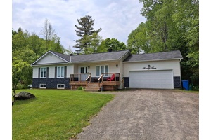Tucked away on a quiet country road just 10 minutes from downtown Huntsville, this updated bungalow offers the perfect balance of rural charm and modern comfort.