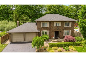 Welcome to a rare offering on one of the most desirable streets in Dundas an exceptional family home backing directly onto a lush ravine, with over 4, 000sqft of total ...