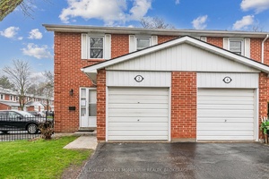 Charming end unit townhouse located in a serene and highly sought after area.