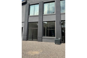Main floor private entrance studio office retail, 13 ft ceilings, bright with epoxy floors
