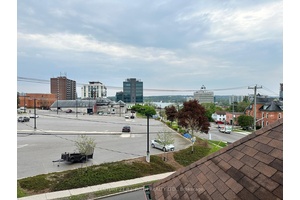 6 self contained apartments in this charming income property on a bus route with a view from the porch and some of the units to Barrie's beautiful waterfront.