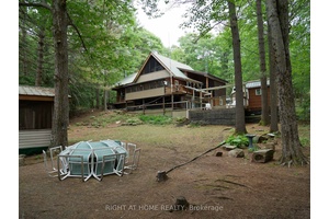 Gull River Quiet Paradise, This Five Bedroom, 4 Washroom Year Round Home Offers It All, From Jacuzzi Tub In Ensuite To Cozy Beamed Ceiling With Gas Fireplace In Livingroom.