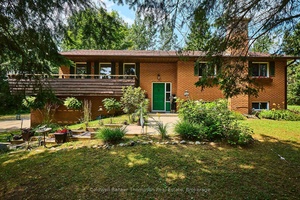 Solid brick split level home resting on a 2 acre lot in the village of Novar.