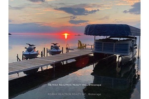 This gorgeous direct lakefront home provides panoramic views of Lake Simcoe from the custom kitchen amp ; living room.