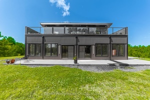 Welcome to 102 Rantz Rd. This Scandinavian style chalet is perched atop the rugged Canadian shield offering sweeping views of the tree tops and glimpses of the Petawawa River.
