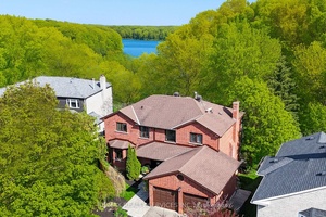Cottage Living in the City Rare Heart Lake Ravine Property Exceptional 4 1 bedroom, 4 bath executive home offers an exceptional lifestyle, backing onto the protected Heart Lake Conservation Area.