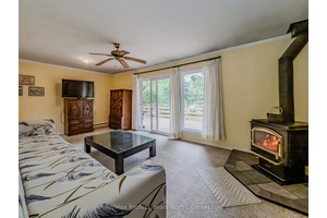 Welcome to your spacious retreat on a sun splashed corner lot, just a leisurely stroll from Gull Lake park, beach, and downtown Gravenhurst cafe s.
