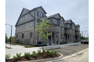 Surround yourself with nature in this sun filled, move in ready condo townhome just steps from Guelph Lake and scenic trails.