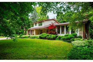 This charming four level side split home is set on a large, mature, fenced lot in a highly desirable neighborhood, offering the perfect blend of tranquility and convenience.