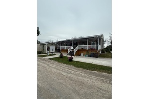 Year round living in Bay Meadows Park, a gated 50 adult community on Lake Ontario in Prince Edward County !