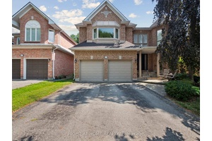 Spacious Five Bedroom Home on a Quiet Crescent backing onto Beautiful Trees and Greenspace for total Privacy.