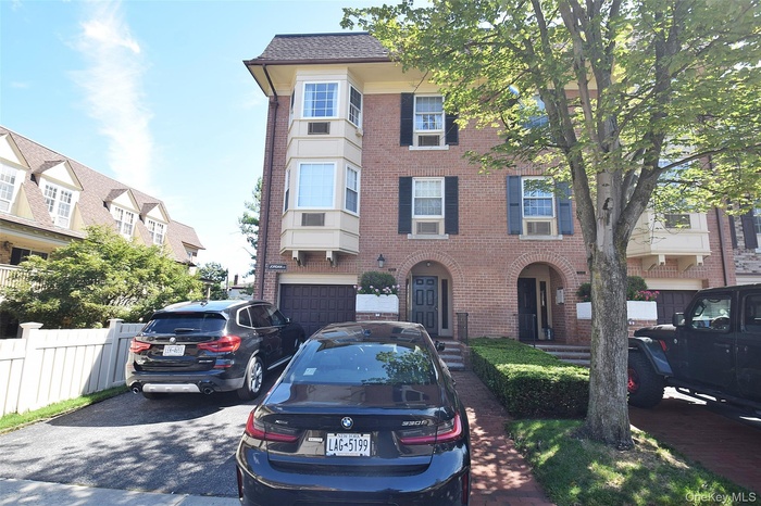 View of front of property with brick siding