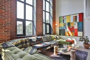 Something truly special at Wonder Condos a sun filled heritage loft with ideal west exposure, dramatic 17 foot ceilings, and original character throughout.