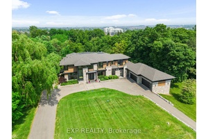 Set on a rare 1. 92 acre ravine lot, over 10, 000 sq ft custom built estate by David Small Designs blends serene Canadian elegance with bold global influence.