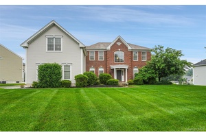 Nestled in sought after Four Corners this stately brick face Colonial blends comfort, style and convenience.