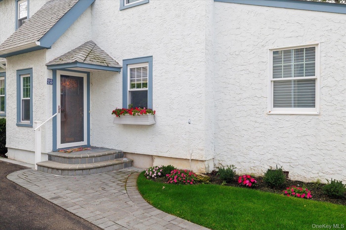 Property entrance featuring stucco siding