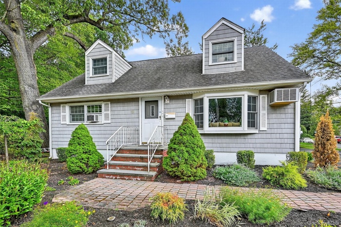 Picture perfect 5 bedroom Cape Cod Colonial on quiet picturesque street