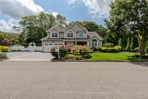 Welcome to this stunning and move in ready Colonial home, perfectly situated mid block on a picturesque, tree lined street.