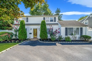 Welcome to 56 Cliff Lane a beautifully maintained 5 bedroom, 2 bathroom Colonial nestled in the heart of Levittown.