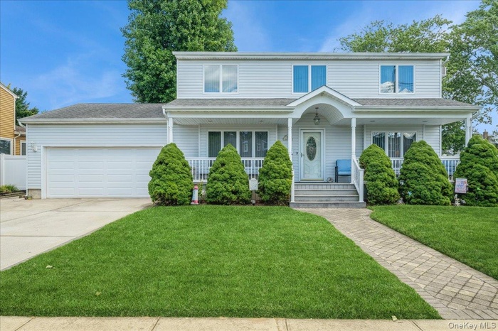 Traditional home with covered porch