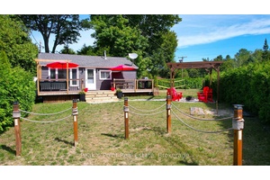 This delightful North Sauble Beach offers a perfect blend of comfort and functionality across two floors.