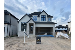 BONUS Separate side entrance to the finished lower level offers excellent rental or in law suite potential.