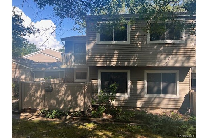 Rear view of property featuring a balcony