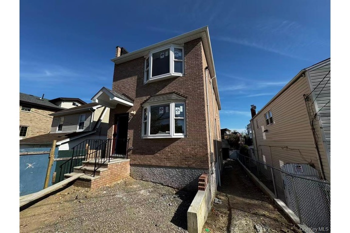 View of front facade featuring brick siding