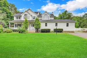 Extra Large, newer colonial style home with full basement, 2 Car Detached garage, accessory area, having hardwood flooring, Eat In Kitchen, Den with fireplace, spacious rooms, and grand appearance.