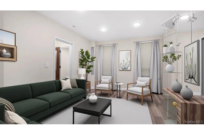 Living area featuring wood finished floors and recessed lighting