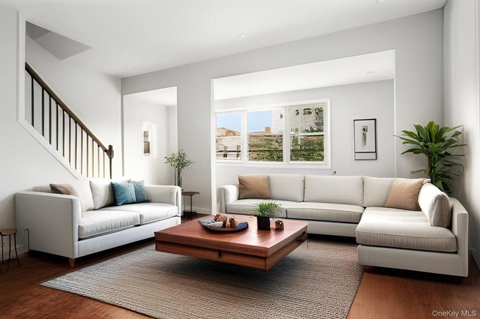 Living area featuring wood finished floors and stairs