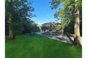 Nestled in the coveted Village of Flower Hill, a stately 2002 built European inspired Contemporary Brick estate effortlessly blends timeless elegance with modern sophistication.
