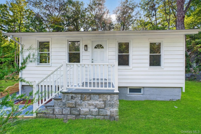 View of front of home with a front lawn