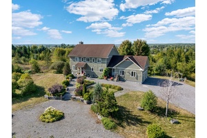 The feeling of serenity begins the moment you turn onto the driveway, with nature surrounding you on both sides all the way up to where the home is perched at ...