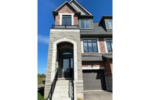 Stunning END UNIT Kensington Model that sides onto the designated Park offering 2054 SF 528 SF in the additional space in the basement level.