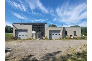 Rural mixed use property developed industrial building, storage outbuilding and small detached bungalow.