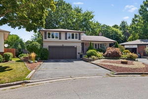 Backyard private paradise on quiet treed Byron court with huge lot.
