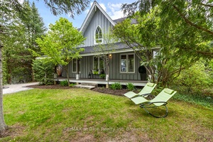 GORGEOUS WINTER CHALET This stunning 4 bedroom country style chalet with covered front porch is in a PRIME location.