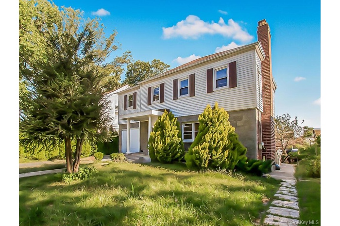 View of front of property with a chimney