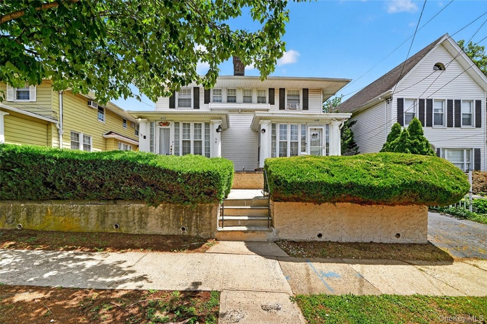 View of front of home with a chimney