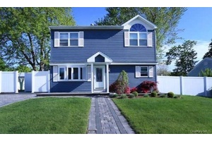 Colonial home in Central Islip, blending comfort and convenience.