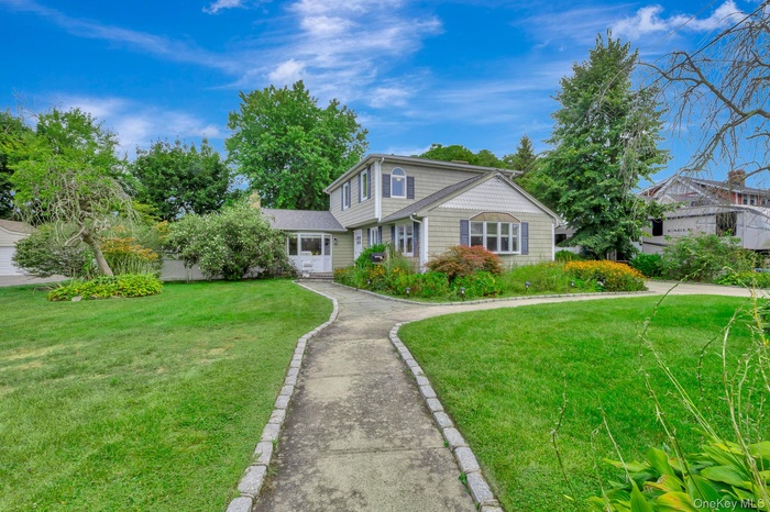 View of front of house with a front yard