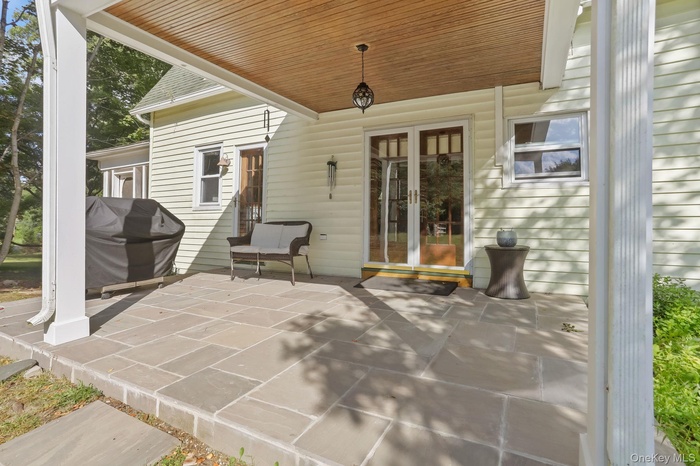 View of patio / terrace featuring a grill and french doors