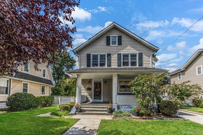 Traditional style home with a porch